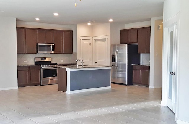 16342 Rockdale Landing Dr, Hockley, TX 77447 - kitchen with appliances with stainless steel finishes, backsplash, a sink, stone countertops, and recessed lighting