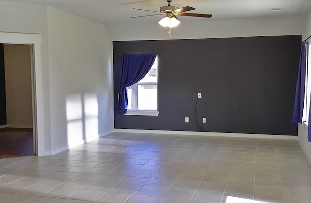 16342 Rockdale Landing Dr, Hockley, TX 77447 - tiled spare room with ceiling fan and baseboards