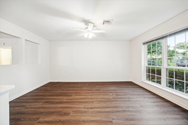 10014 Moorberry Ln, Houston, TX 77080 - unfurnished room featuring ornamental molding, a ceiling fan, wood finished floors, and baseboards
