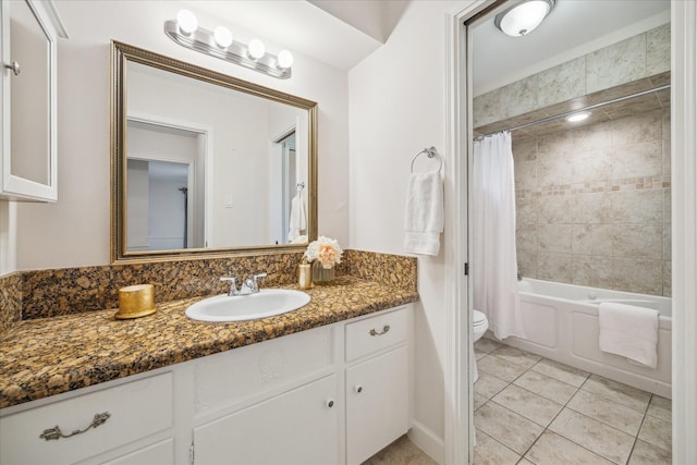 10014 Moorberry Ln, Houston, TX 77080 - full bath featuring tile patterned floors, toilet, vanity, and shower / bath combo