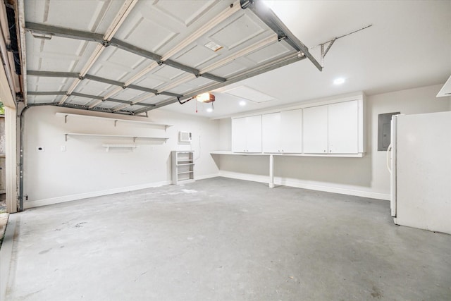 10014 Moorberry Ln, Houston, TX 77080 - garage featuring a garage door opener, electric panel, freestanding refrigerator, and recessed lighting