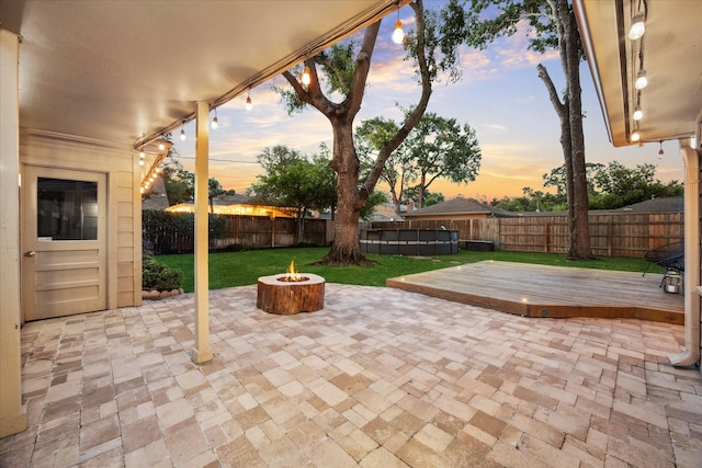 10014 Moorberry Ln, Houston, TX 77080 - patio terrace at dusk with a fire pit and a wooden deck