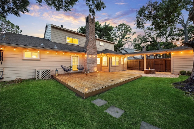 10014 Moorberry Ln, Houston, TX 77080 - back of house at dusk featuring a deck and a chimney
