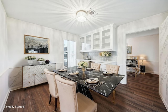 10014 Moorberry Ln, Houston, TX 77080 - dining space featuring dark wood finished floors, crown molding, and baseboards