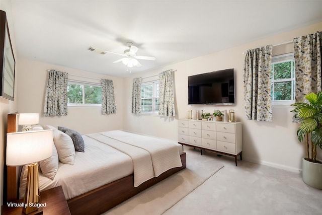 10014 Moorberry Ln, Houston, TX 77080 - bedroom featuring light carpet, baseboards, and ceiling fan