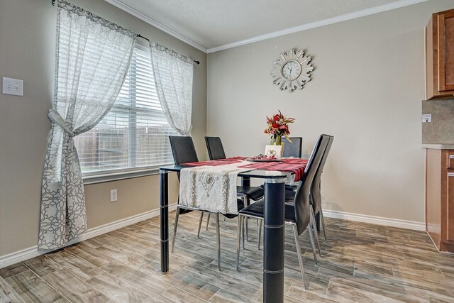 10911 Crosby Field Ln, Houston, TX 77034 - dining area with plenty of natural light, ornamental molding, light wood-style floors, and baseboards