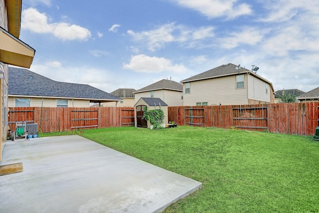 10911 Crosby Field Ln, Houston, TX 77034 - view of yard featuring a patio area, a shed, an outbuilding, and central air condition unit