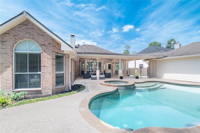 view of pool with a ceiling fan, a patio area, a pool with connected hot tub, and an outdoor hangout area