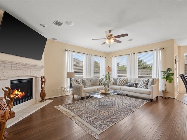 22603 Blanefield Ct, Tomball, TX 77375 - living room with ceiling fan, hardwood / wood-style floors, baseboards, and a fireplace