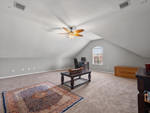 living area with carpet floors, ceiling fan, lofted ceiling, and baseboards