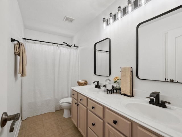 22603 Blanefield Ct, Tomball, TX 77375 - bathroom featuring double vanity, toilet, and tile patterned floors