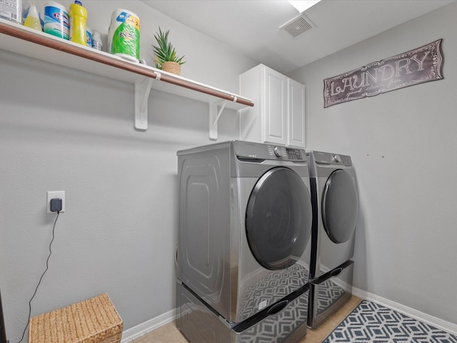22603 Blanefield Ct, Tomball, TX 77375 - washroom featuring cabinet space, washer and dryer, and baseboards