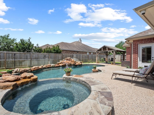 22603 Blanefield Ct, Tomball, TX 77375 - view of swimming pool with a gazebo, a fenced backyard, a pool with connected hot tub, and a patio area