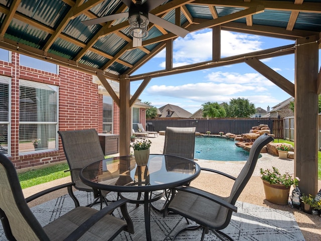 22603 Blanefield Ct, Tomball, TX 77375 - fenced backyard featuring a patio area, outdoor dining space, and a ceiling fan