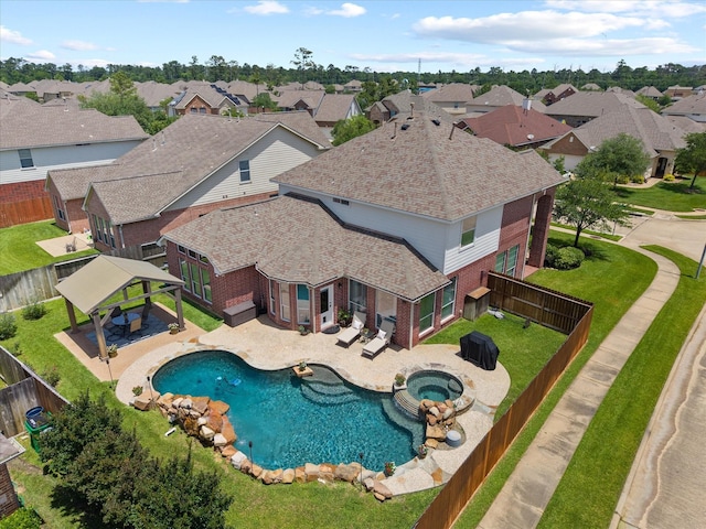 22603 Blanefield Ct, Tomball, TX 77375 - view of swimming pool with a gazebo, a fenced backyard, and a residential view