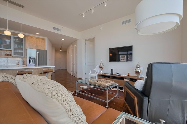 2207 Bancroft St Unit 604, Houston, TX 77027 - living room featuring dark wood-style floors, rail lighting, and recessed lighting