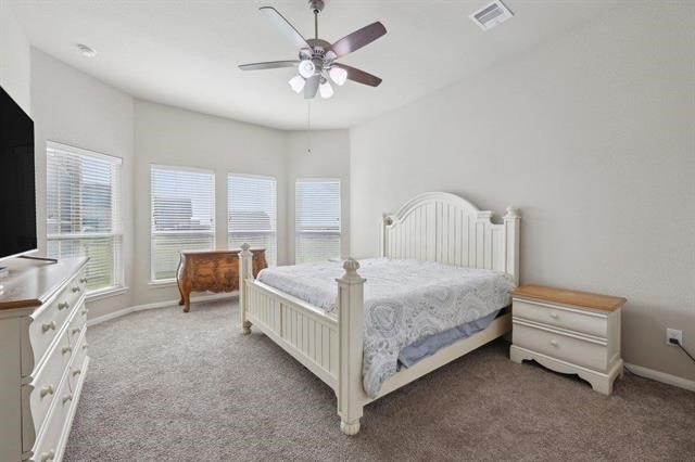 2498 Diamond D Dr, Beaumont, TX 77713 - bedroom with carpet flooring, baseboards, and ceiling fan