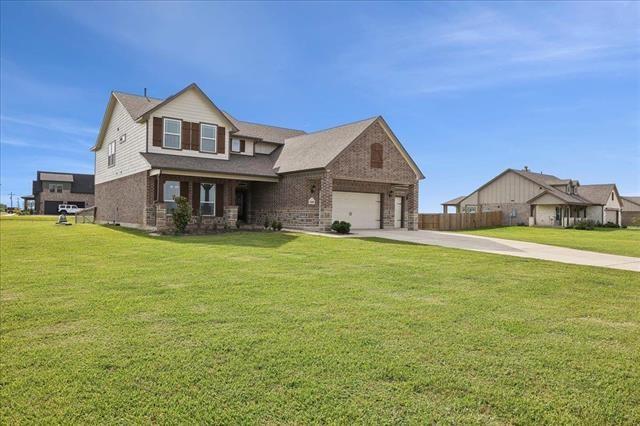 2498 Diamond D Dr, Beaumont, TX 77713 - view of front of property with driveway, a front lawn, and brick siding