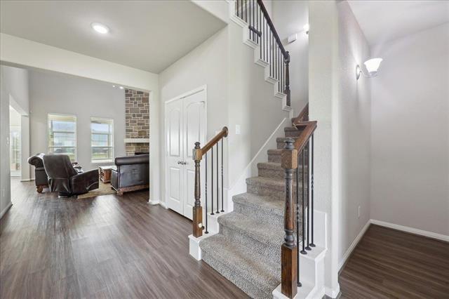 2498 Diamond D Dr, Beaumont, TX 77713 - foyer featuring stairway, dark wood-style floors, and baseboards