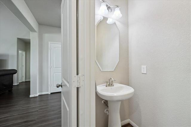 2498 Diamond D Dr, Beaumont, TX 77713 - bathroom featuring wood finished floors and baseboards