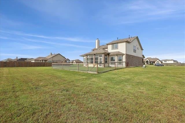 2498 Diamond D Dr, Beaumont, TX 77713 - rear view of property with a chimney