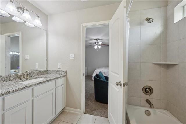 2498 Diamond D Dr, Beaumont, TX 77713 - ensuite bathroom with a ceiling fan, tile patterned flooring, vanity, shower / washtub combination, and baseboards