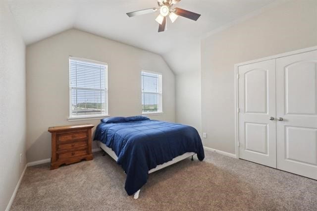2498 Diamond D Dr, Beaumont, TX 77713 - bedroom featuring vaulted ceiling, carpet floors, baseboards, a ceiling fan, and a closet