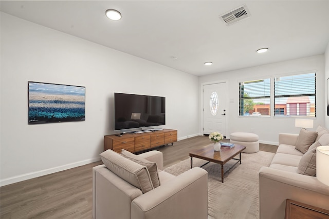 404 Glenmore Dr, Pasadena, TX 77503 - living area featuring baseboards, wood finished floors, and recessed lighting