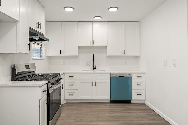 404 Glenmore Dr, Pasadena, TX 77503 - kitchen with dishwasher, stainless steel gas stove, a sink, under cabinet range hood, and white cabinets