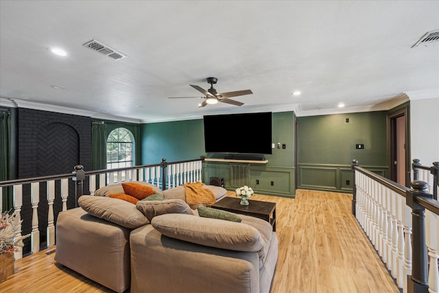 24615 Mount Auburn Dr, Katy, TX 77494 - living area with ceiling fan, crown molding, light wood-style flooring, recessed lighting, and wainscoting
