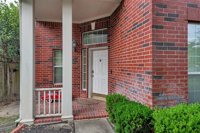 13111 Porter Meadow Ln, Houston, TX 77014 - property entrance featuring brick siding and a porch