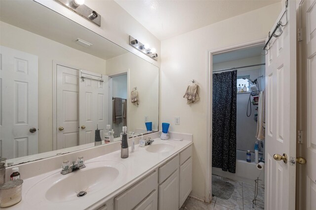 13111 Porter Meadow Ln, Houston, TX 77014 - bathroom with double vanity, shower / bath combo, and marble finish floors