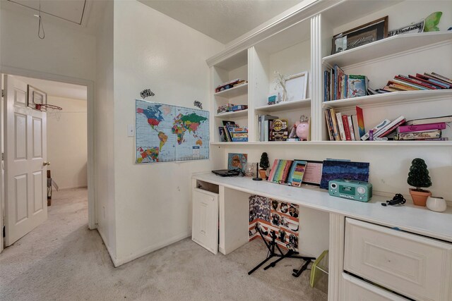 13111 Porter Meadow Ln, Houston, TX 77014 - home office with light carpet, attic access, and built in study area
