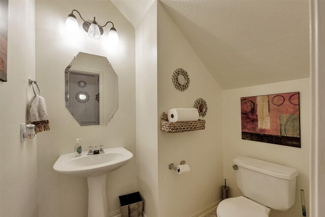 13111 Porter Meadow Ln, Houston, TX 77014 - bathroom with toilet, vaulted ceiling, and baseboards