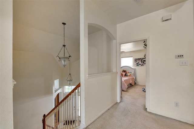 13111 Porter Meadow Ln, Houston, TX 77014 - hallway featuring carpet floors, arched walkways, and baseboards