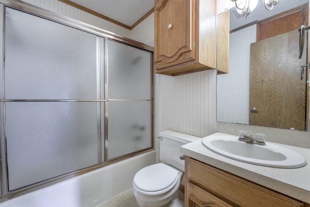 207 Oak Hill Dr, Brenham, TX 77833 - bathroom with toilet, vanity, shower / bath combination with glass door, and a textured ceiling