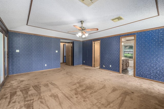 207 Oak Hill Dr, Brenham, TX 77833 - unfurnished room featuring a textured ceiling, carpet floors, a ceiling fan, and crown molding