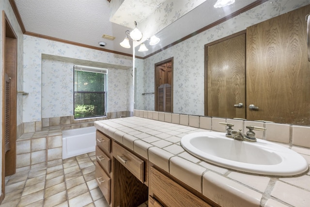 207 Oak Hill Dr, Brenham, TX 77833 - bathroom with wallpapered walls, ornamental molding, vanity, a chandelier, and a bathtub