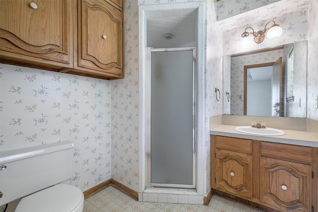 207 Oak Hill Dr, Brenham, TX 77833 - full bathroom with wallpapered walls, a shower stall, vanity, toilet, and tile patterned floors