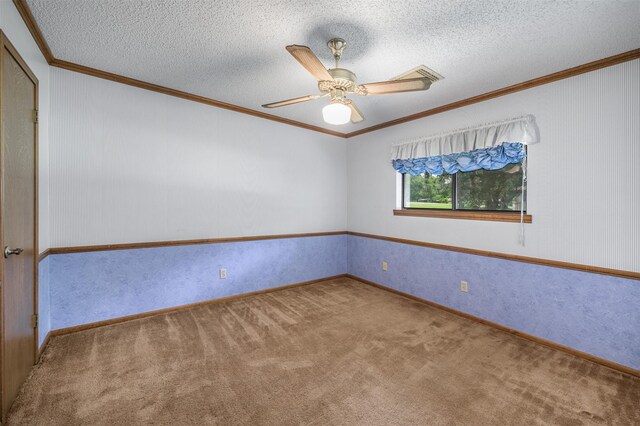 207 Oak Hill Dr, Brenham, TX 77833 - carpeted spare room featuring crown molding, a ceiling fan, a textured ceiling, and baseboards