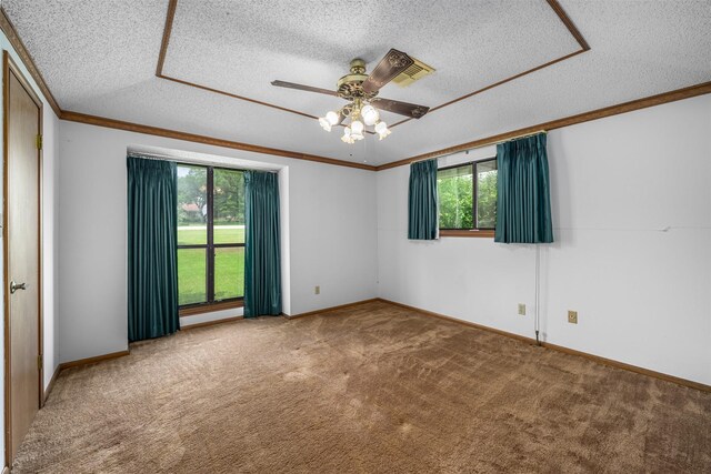 207 Oak Hill Dr, Brenham, TX 77833 - carpeted empty room with a textured ceiling, a ceiling fan, baseboards, and ornamental molding