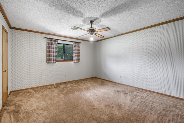 207 Oak Hill Dr, Brenham, TX 77833 - unfurnished room with crown molding, carpet flooring, ceiling fan, and baseboards