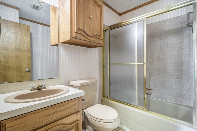 207 Oak Hill Dr, Brenham, TX 77833 - full bath featuring wallpapered walls, ornamental molding, a textured ceiling, toilet, and bath / shower combo with glass door