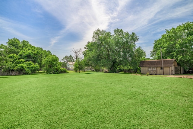207 Oak Hill Dr, Brenham, TX 77833 - view of green lawn with an outbuilding