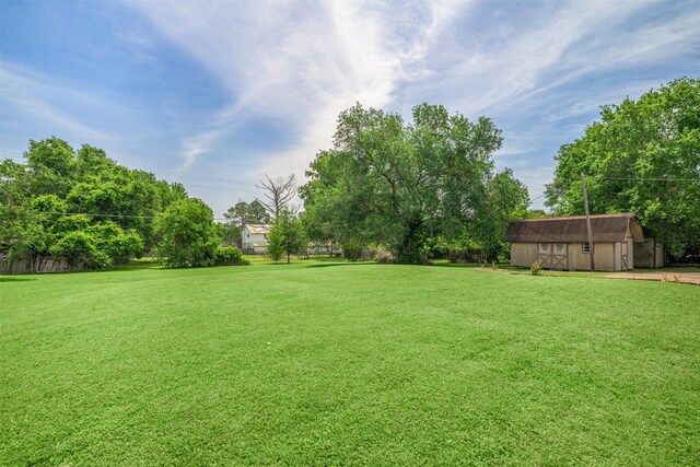207 Oak Hill Dr, Brenham, TX 77833 - view of green lawn with an outdoor structure