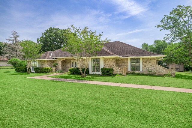 207 Oak Hill Dr, Brenham, TX 77833 - ranch-style house featuring a front yard and brick siding