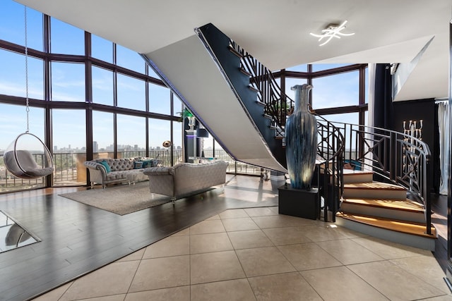 3350 Mccue Rd Unit 2404, Houston, TX 77056 - common area with a wall of windows, a towering ceiling, stairway, and a view of city