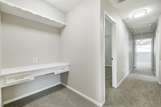 28902 Twisted Oak Dr, Shenandoah, TX 77381 - corridor with carpet, attic access, an office area, baseboards, and a textured ceiling