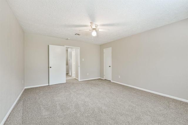 28902 Twisted Oak Dr, Shenandoah, TX 77381 - unfurnished bedroom with carpet floors, baseboards, a textured ceiling, and a ceiling fan