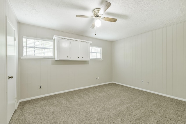 28902 Twisted Oak Dr, Shenandoah, TX 77381 - carpeted empty room featuring a textured ceiling, ceiling fan, and baseboards
